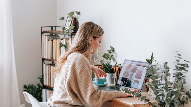 Woman working from home after securing a contractor mortgage.