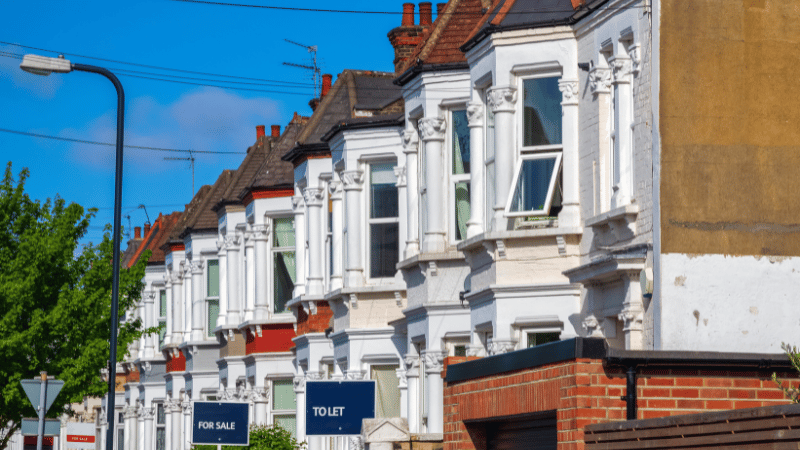 A street view of a row of traditional Victorian terraced houses, many of which are leasehold properties affected by UK property law reform.